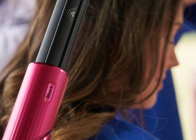 Hair styling with curling iron at Boots at Moonlight Meadows, Stradbally, County Laois, IE.