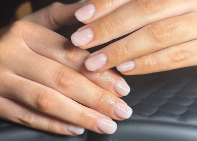Manicured hands with glossy nails at Claws by Jaimee, Hope Island, Queensland, AU.