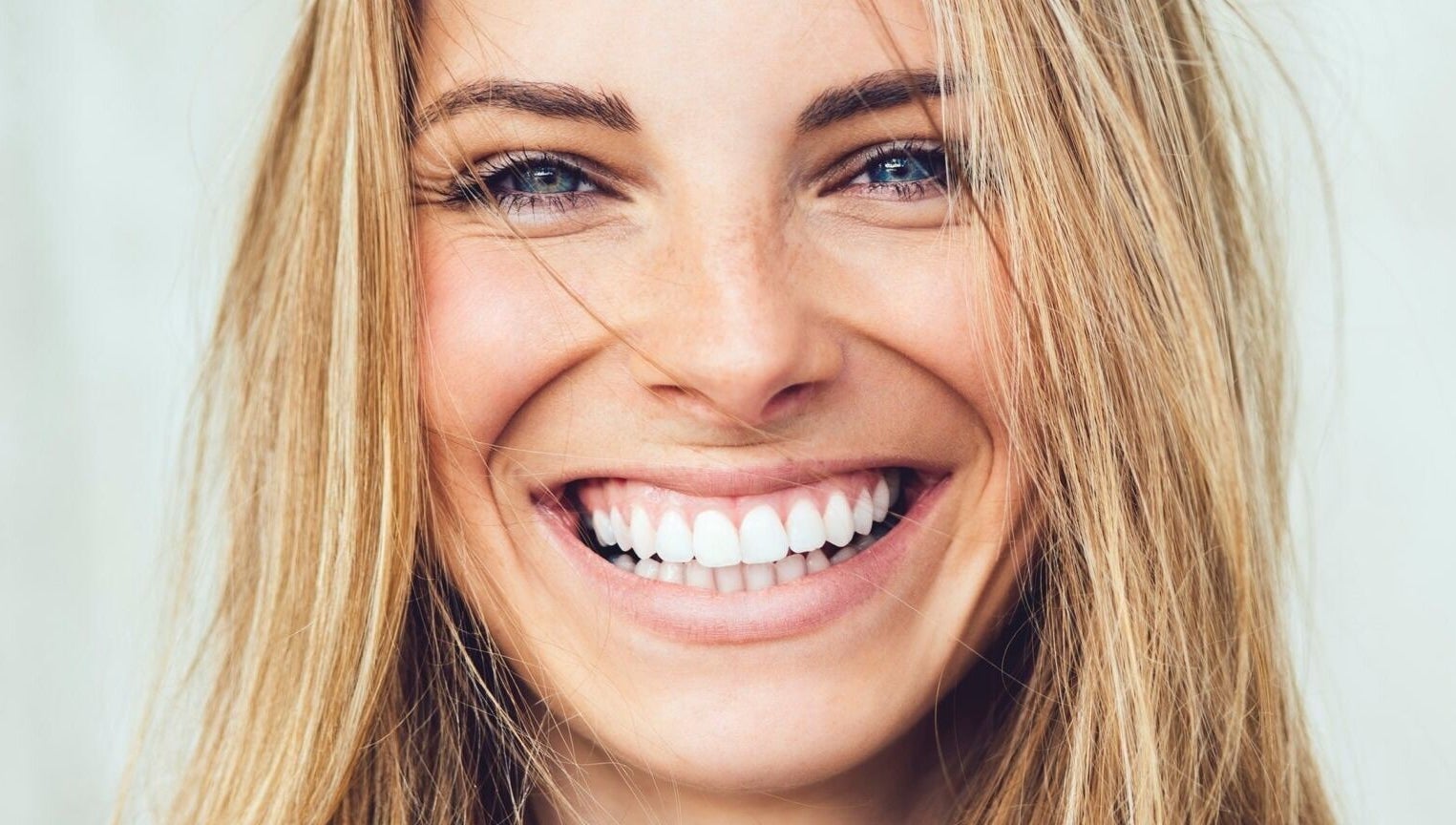 Close-up of a woman's radiant smile at Gunther Oliver - Skin Medic / Cape Town, Western Cape, ZA.
