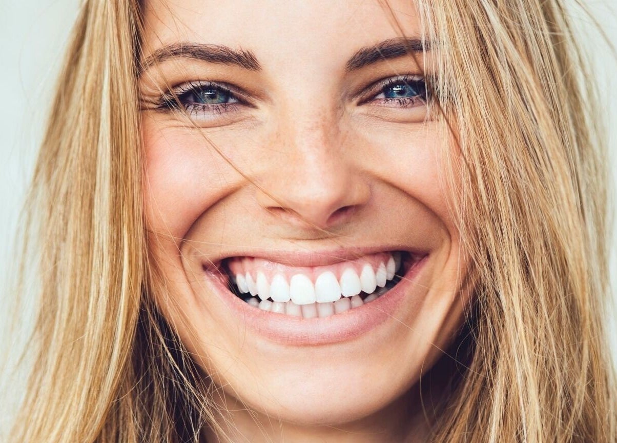 Close-up of a woman's radiant smile at Gunther Oliver - Skin Medic / Cape Town, Western Cape, ZA.