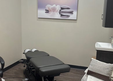 Peaceful therapy room at All About Beauty Salon, Eagan, Minnesota, US, featuring a comfortable treatment table.