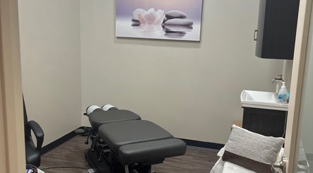 Peaceful therapy room at All About Beauty Salon, Eagan, Minnesota, US, featuring a comfortable treatment table.