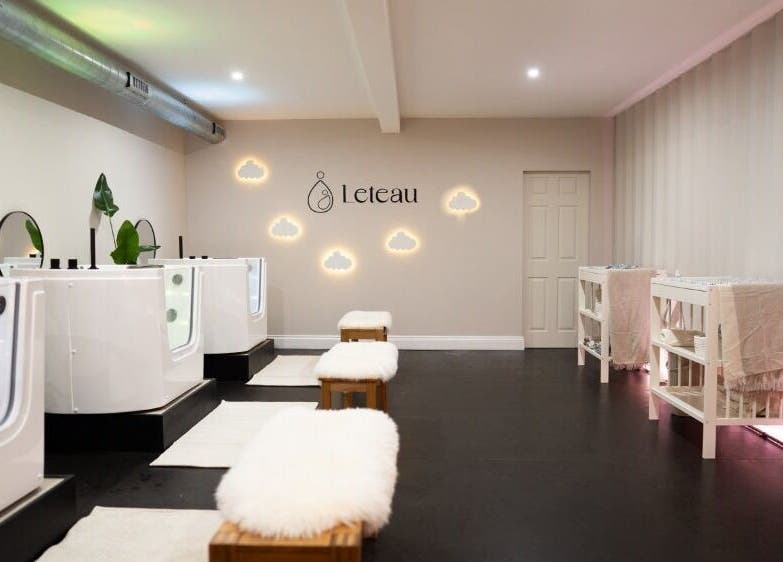 Modern wellness space at Leteau, Bristol, England, GB with plush seating and ambient lighting.