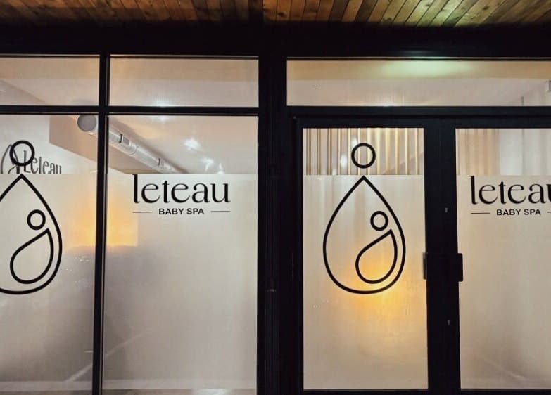 Exterior of Leteau Baby Spa in Bristol, England, GB featuring logo and glass doors.