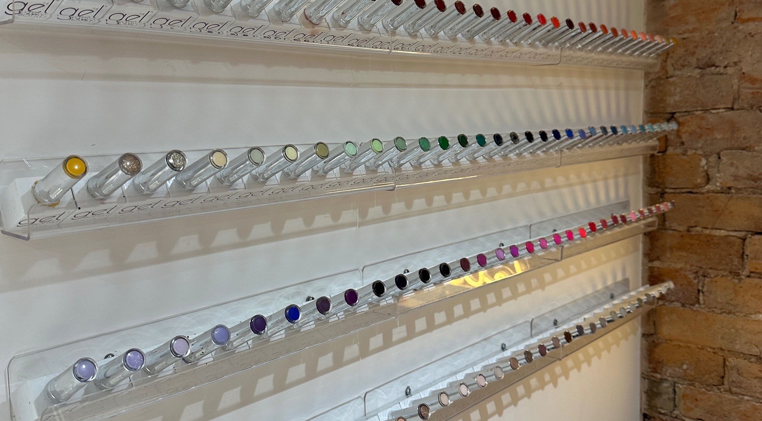 Vibrant nail polish collection at Nails By Kay in Bromsgrove, England, GB, showcasing diverse colors neatly organized.