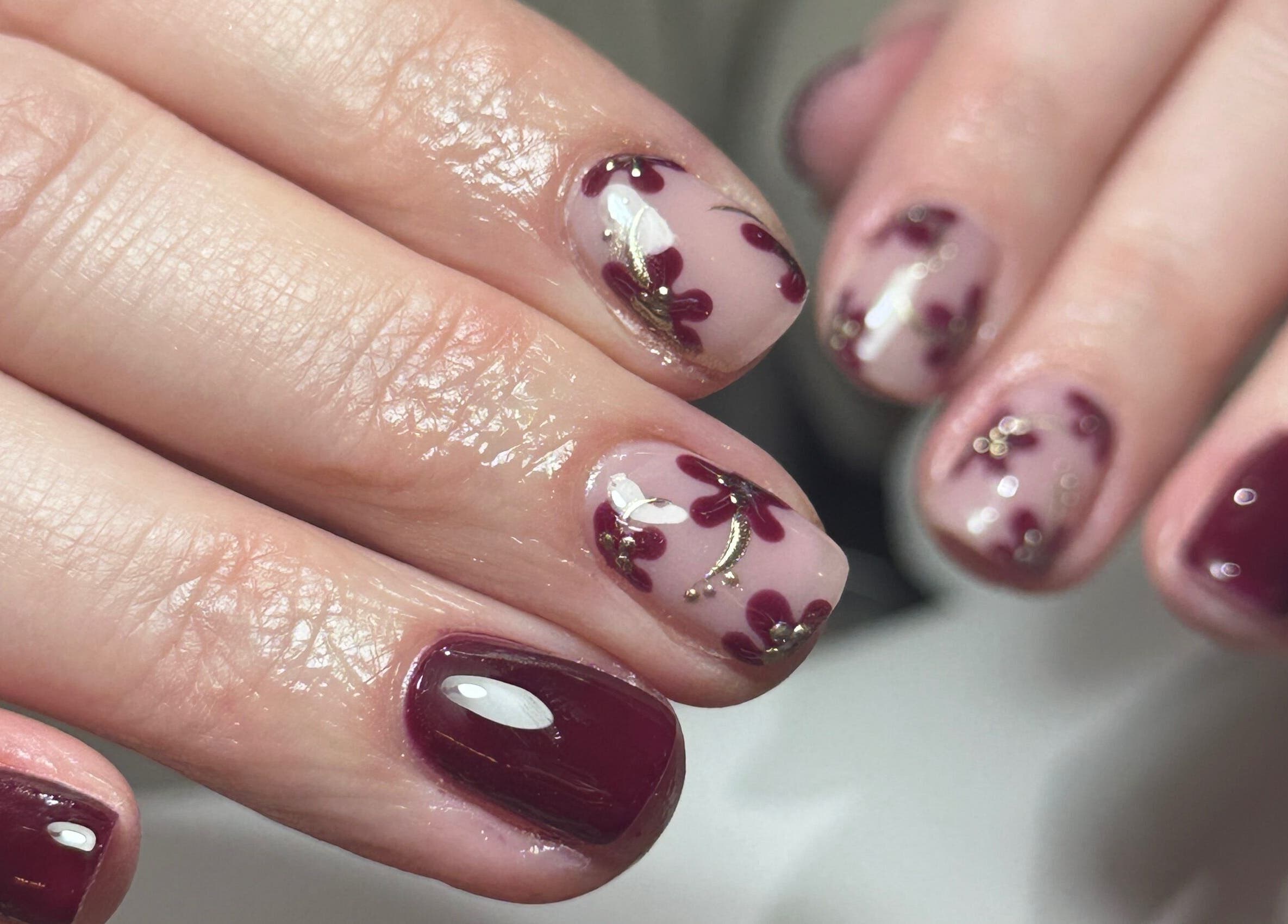 Elegant nail art with floral designs at Nails By Kay, Bromsgrove, England, GB.