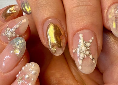 Intricate gold and pearl nail art at Jada Ellize Nails, London, England, GB showcases elegance and detail.