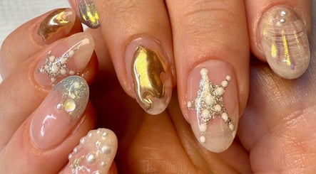 Intricate gold and pearl nail art at Jada Ellize Nails, London, England, GB showcases elegance and detail.