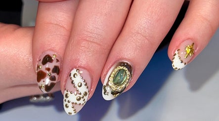 Elegant nail art design at Jada Ellize Nails, London, England, GB, featuring luxury gold embellishments.