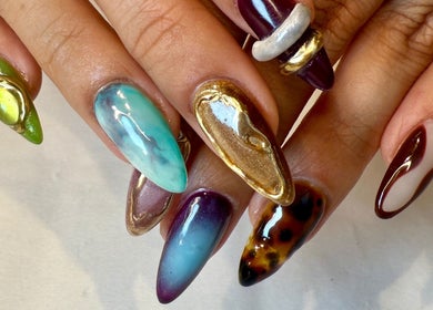 Intricate nail art at Jada Ellize Nails, London, England, GB showcasing vibrant colors and ornate designs.