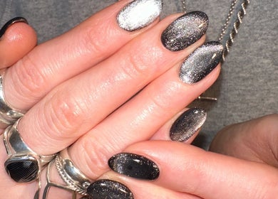 Sparkling manicured nails at Jada Ellize Nails, London, England, GB showcase metallic finishes.