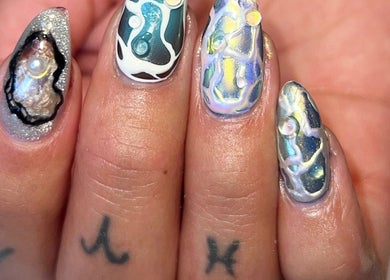 Intricate nail art with pearl theme at Jada Ellize Nails, London, England, GB. Unique and artistic designs.