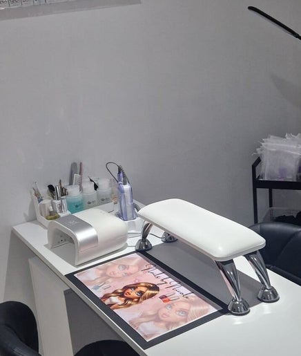 Nail station setup at Polished by Isobel in Oughtibridge, England, GB, showcasing manicure tools and equipment.