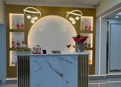 Stylish reception at Nailounge Hounslow, featuring elegant decor and warm lighting in Hounslow, England, GB.
