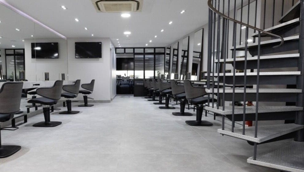 Spacious beauty salon at Contesse Aesthetics, Solihull, England, GB featuring sleek styling stations and mirrors.