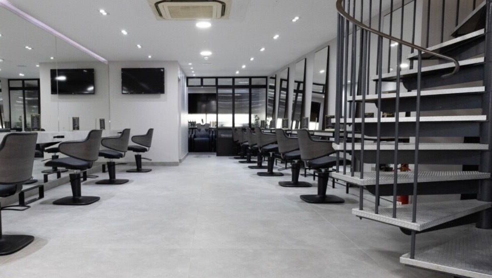 Spacious beauty salon at Contesse Aesthetics, Solihull, England, GB featuring sleek styling stations and mirrors.