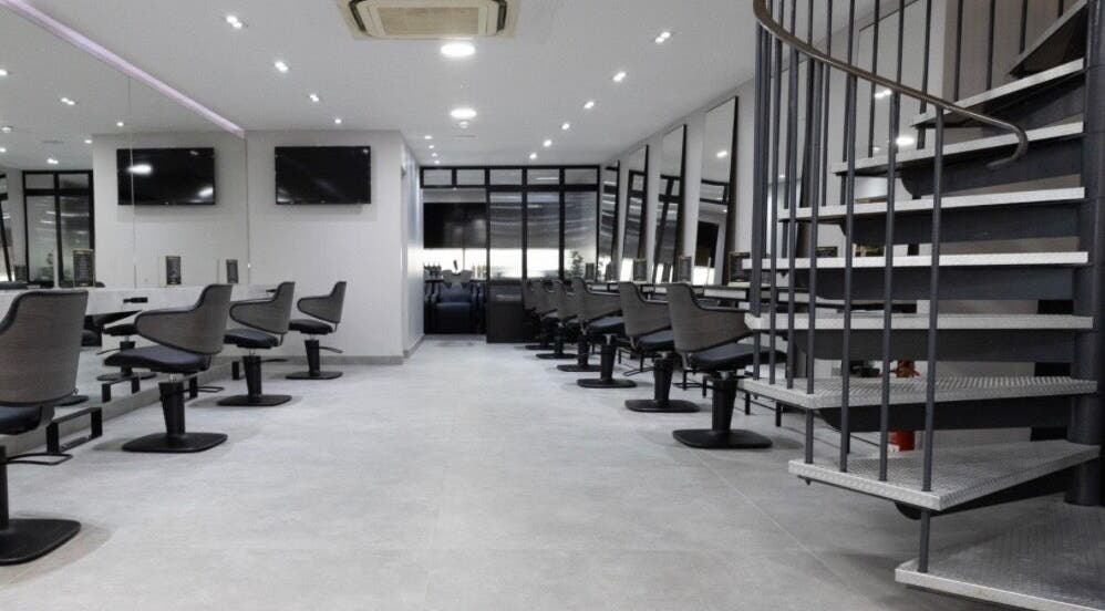 Spacious beauty salon at Contesse Aesthetics, Solihull, England, GB featuring sleek styling stations and mirrors.