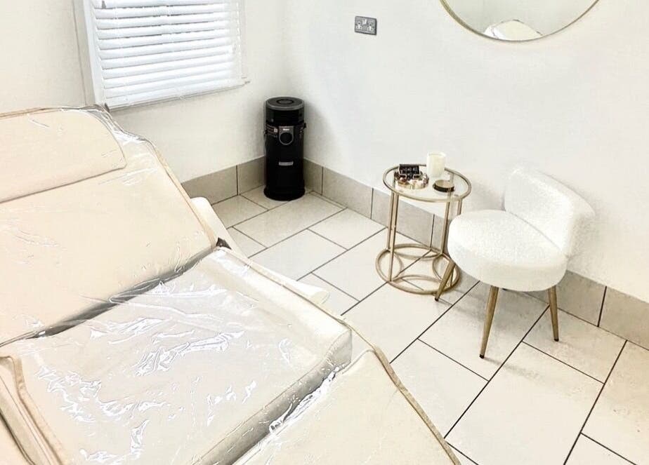 Elegant treatment room at Contesse Aesthetics in Solihull, England, GB, featuring a comfortable treatment bed and chic decor.