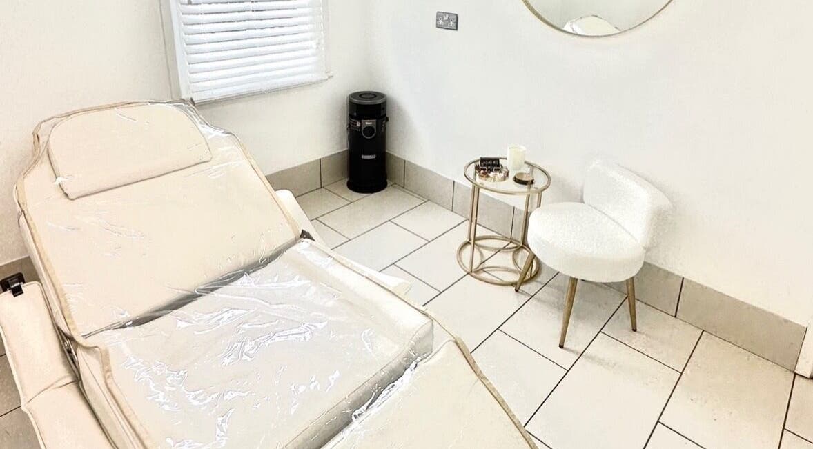 Elegant treatment room at Contesse Aesthetics in Solihull, England, GB, featuring a comfortable treatment bed and chic decor.
