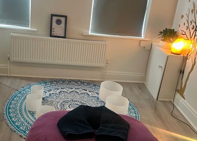 Peaceful therapy room at Rooted Therapies by Vic, Whiston, England, GB. Features cozy decor and a glowing lamp.