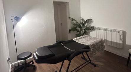 Cozy massage room at Rooted Therapies by Vic at Bohemian Stars, Liverpool, England, GB.