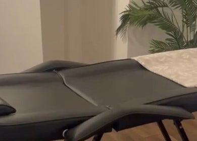 Massage table at Rooted Therapies by Vic at Bohemian Stars, Liverpool, England, GB with calming decor.