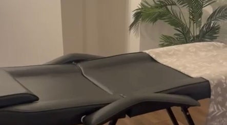 Massage table at Rooted Therapies by Vic at Bohemian Stars, Liverpool, England, GB with calming decor.
