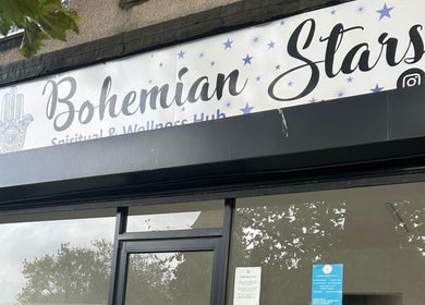 Front view of Rooted Therapies by Vic at Bohemian Stars, Liverpool, England, GB, displaying its signage.
