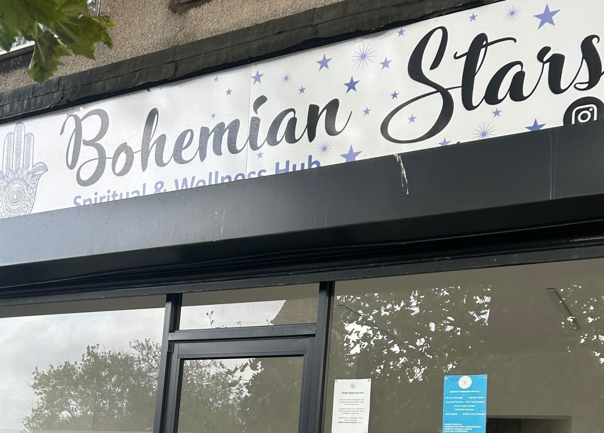 Entrance of Rooted Therapies by Vic at Bohemian Stars, Liverpool, England, GB, with Bohemian Stars signage.
