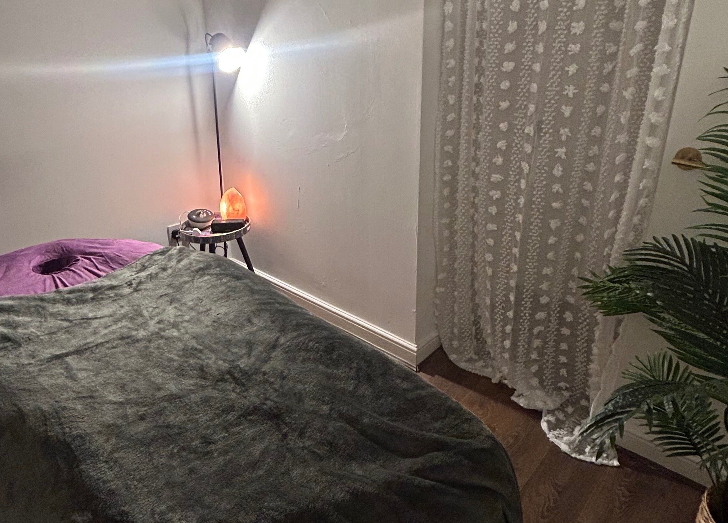 Tranquil massage room at Rooted Therapies by Vic at Bohemian Stars, Liverpool, England, GB. Cozy and inviting setup.