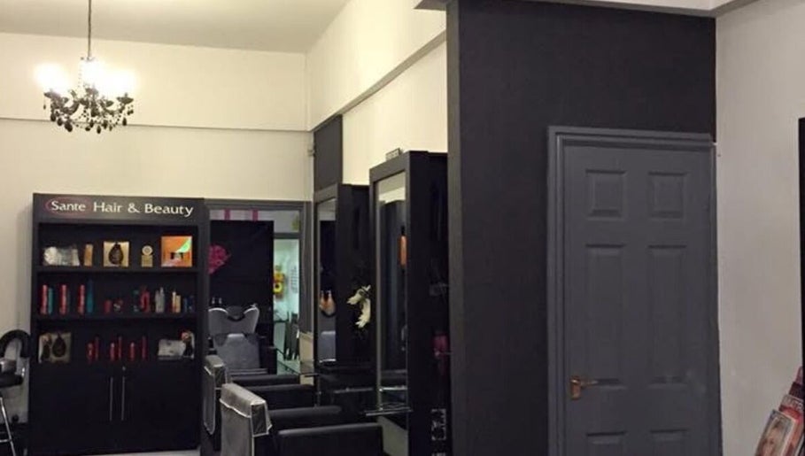 Interior of Hair By Tamzin Louise salon in Stoke-on-Trent, England, GB showcasing modern design and styling area.