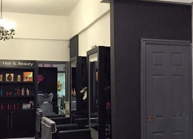 Interior of Hair By Tamzin Louise salon in Stoke-on-Trent, England, GB showcasing modern design and styling area.