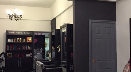 Interior of Hair By Tamzin Louise salon in Stoke-on-Trent, England, GB showcasing modern design and styling area.