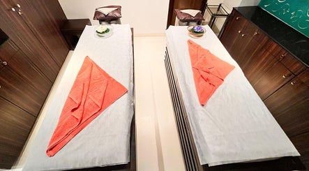 Relaxing twin massage beds at Ojas Wellness Spa, Bengaluru, Karnataka, IN, ready with plush towels.
