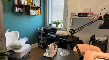 Beauty by Zoe in Griffithstown, Wales offers a serene treatment room with cozy seating and stylish decor.