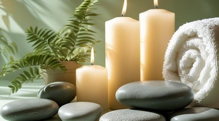 Relaxing setting with candles and stones at Jayora Beauty, Old Colwyn, Wales, GB.