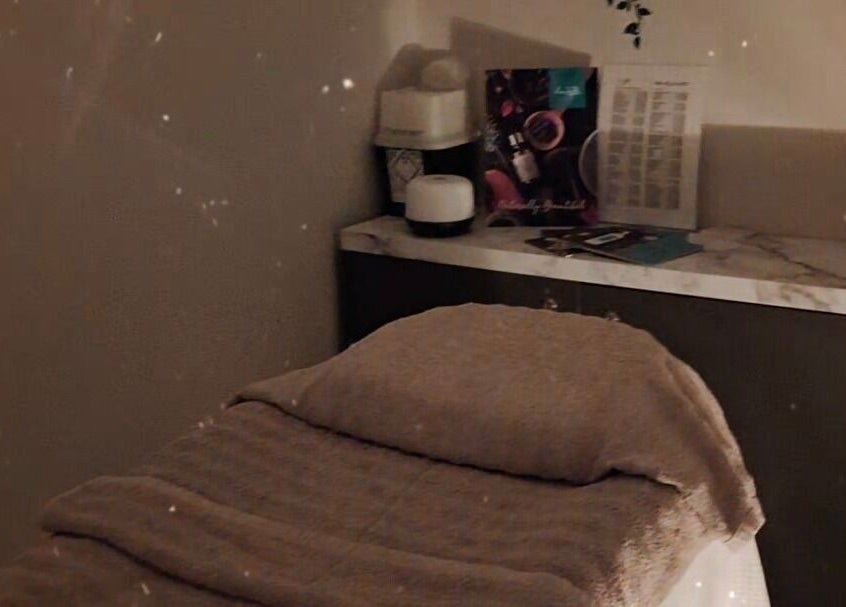 Serene massage room at Jayora Beauty in Colwyn Bay, Wales, GB, featuring a cozy massage bed.