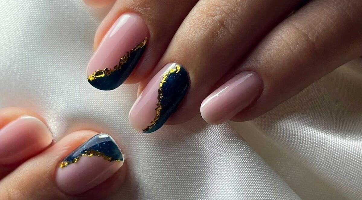 Stylish nail art with navy and gold accents at Deni.xnails, București, București, RO.