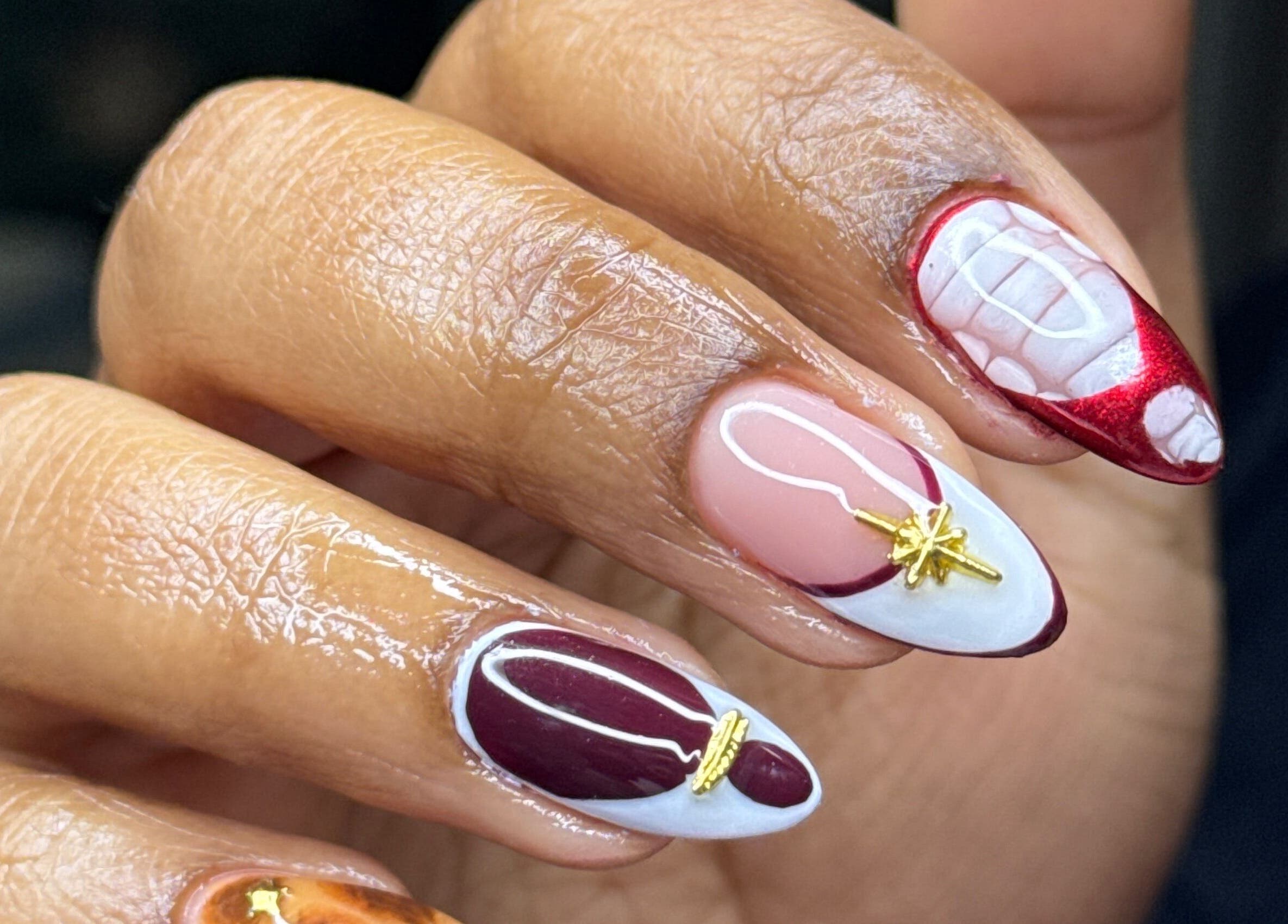 Intricate nail art on a hand at Lesedi Naildit, Cape Town, Western Cape, ZA showcasing creative design.