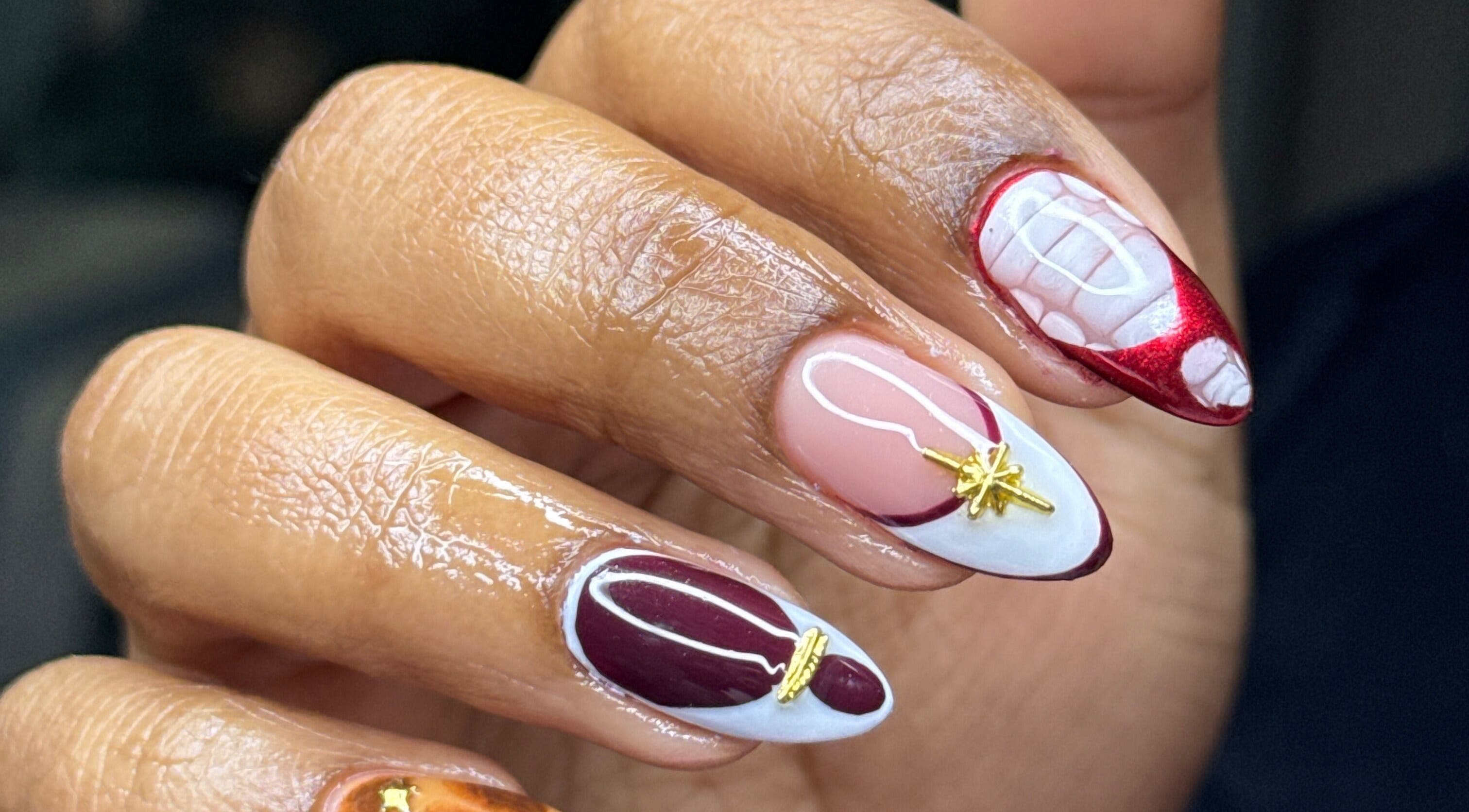Intricate nail art on a hand at Lesedi Naildit, Cape Town, Western Cape, ZA showcasing creative design.