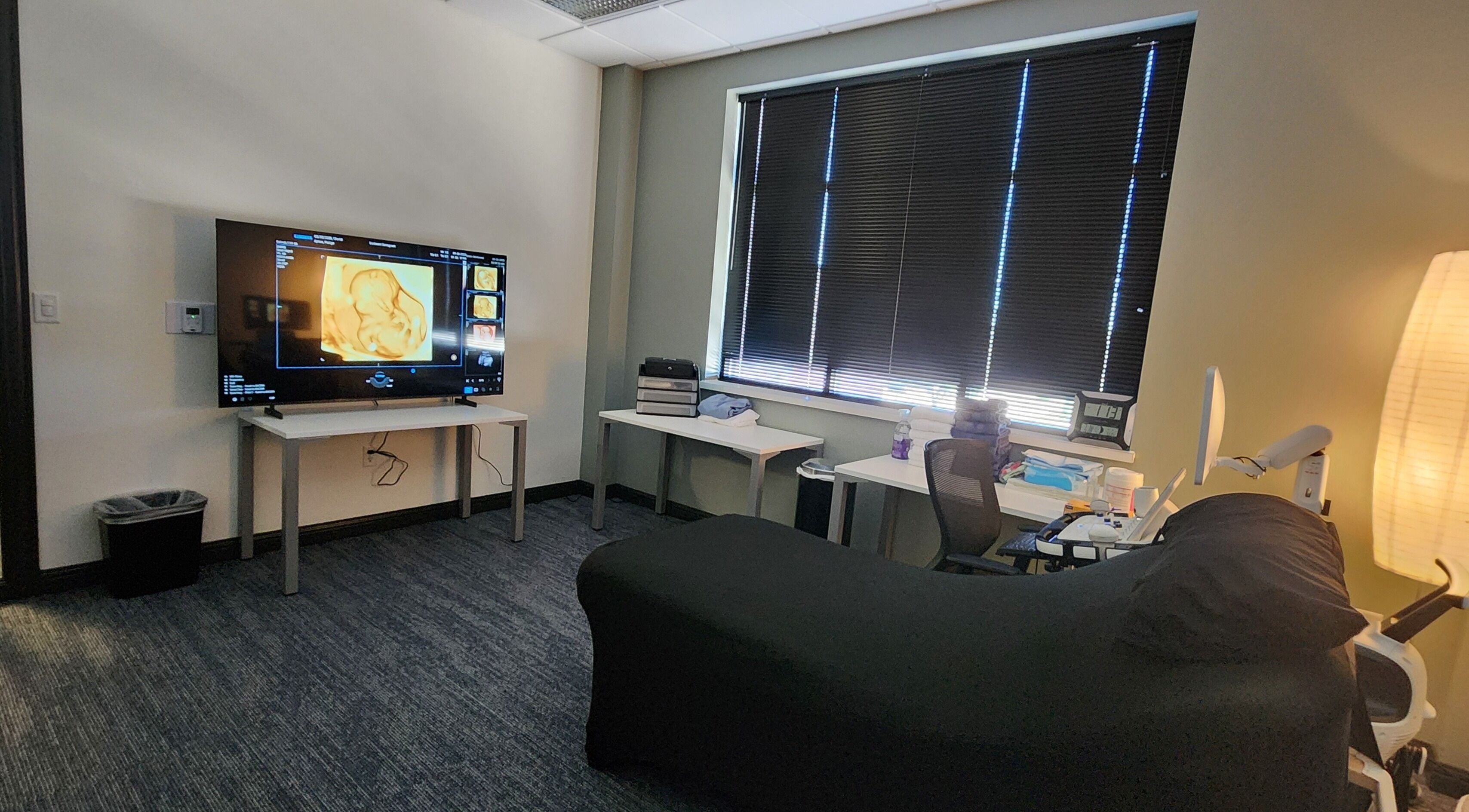 Modern sonogram room at Sunbeam Sonogram in De Pere, Wisconsin, US with cozy decor and advanced equipment.