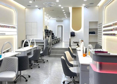 Modern interior of Palette Nails Studio in New York, New York, US, showcasing elegant nail stations and polish display.