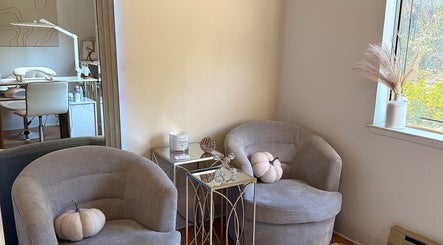 Elegant waiting area at Eva Nails in Sonora, California, US. Features chic chairs and decor.