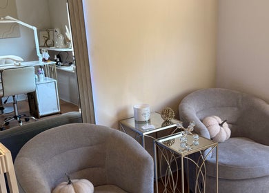 Relaxing nail salon lounge at Eva Nails in Sonora, California, US with plush seating and decor.