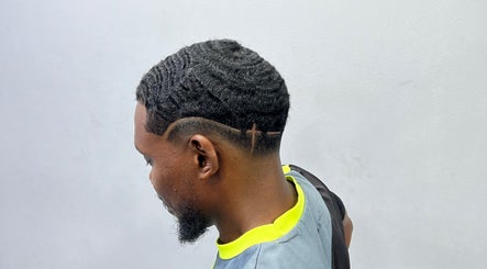Stylish wave haircut with design at Empire Fades Tonsorium in Arima, Arima Borough Corporation, TT.