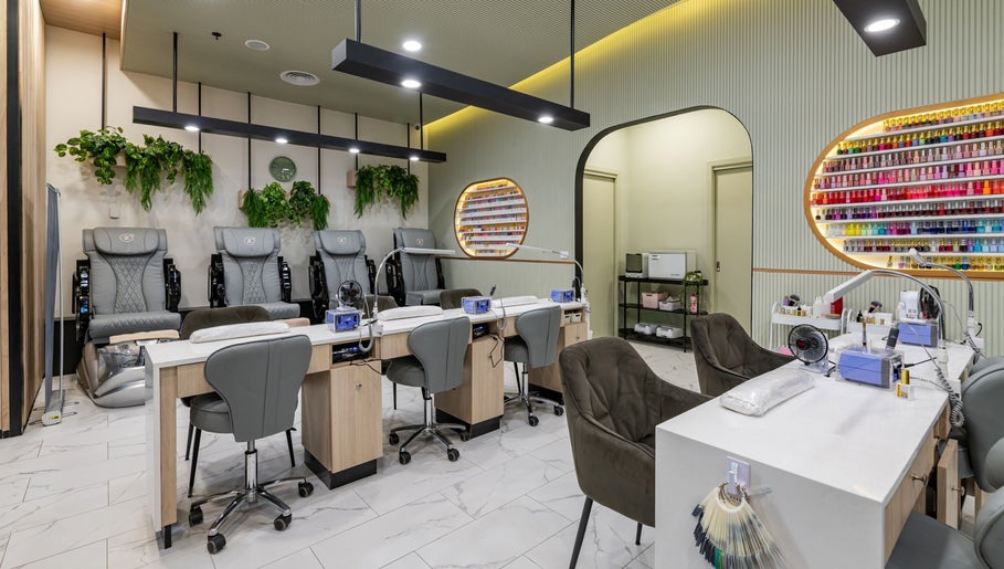 Beauty Genesis - Brunswick in Melbourne, Victoria with stylish nail salon seating and vibrant polish display.