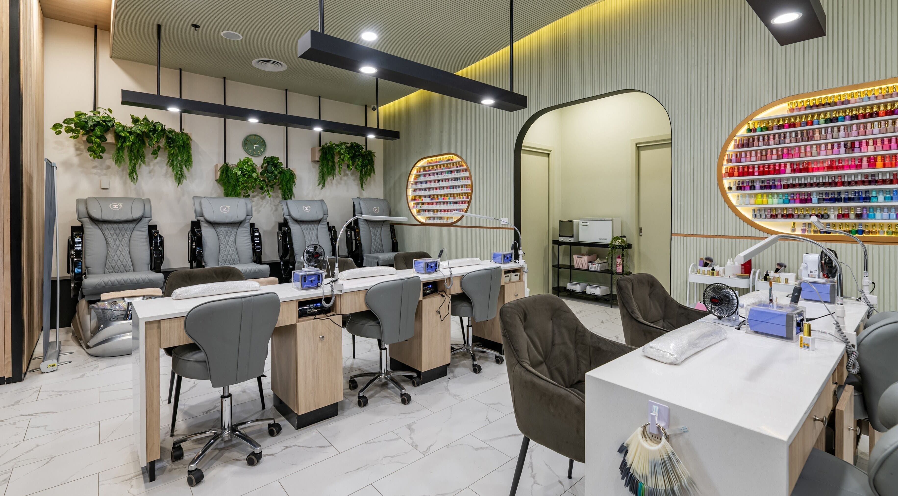 Beauty Genesis - Brunswick in Melbourne, Victoria with stylish nail salon seating and vibrant polish display.