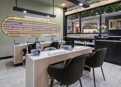 Modern nail salon interior at Beauty Genesis - Brunswick, Melbourne, Victoria, AU with elegant seating and polish display.
