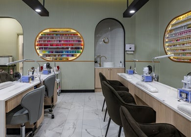 Modern nail salon at Beauty Genesis - Brunswick, Melbourne, Victoria, AU showcasing vibrant nail polish wall.