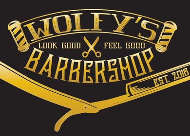 Gold razor logo of Wolfy’s Barbershop in Sedalia, Missouri, US, featuring scissors and barber pole.